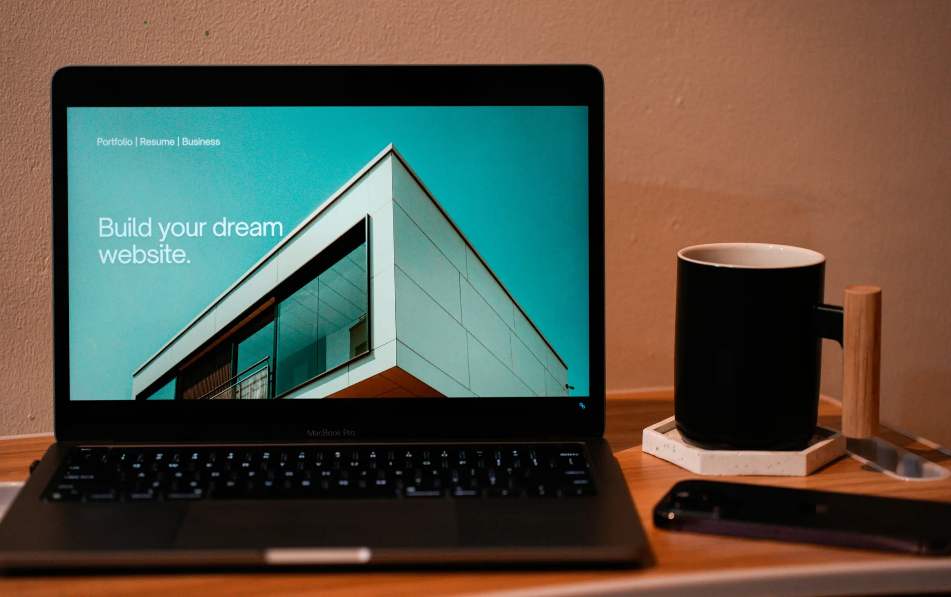 Laptop showing website builder interface for building professional websites without coding